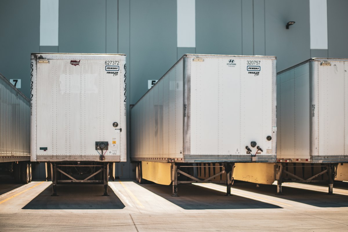 Semi trailers backed into warehouse loading docks